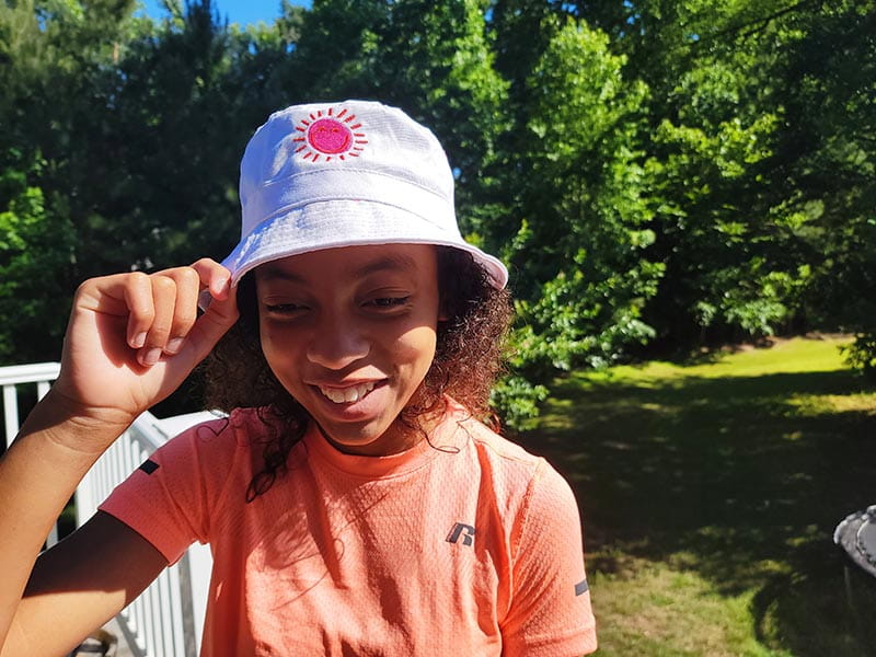 Girl with cheap bucket hat